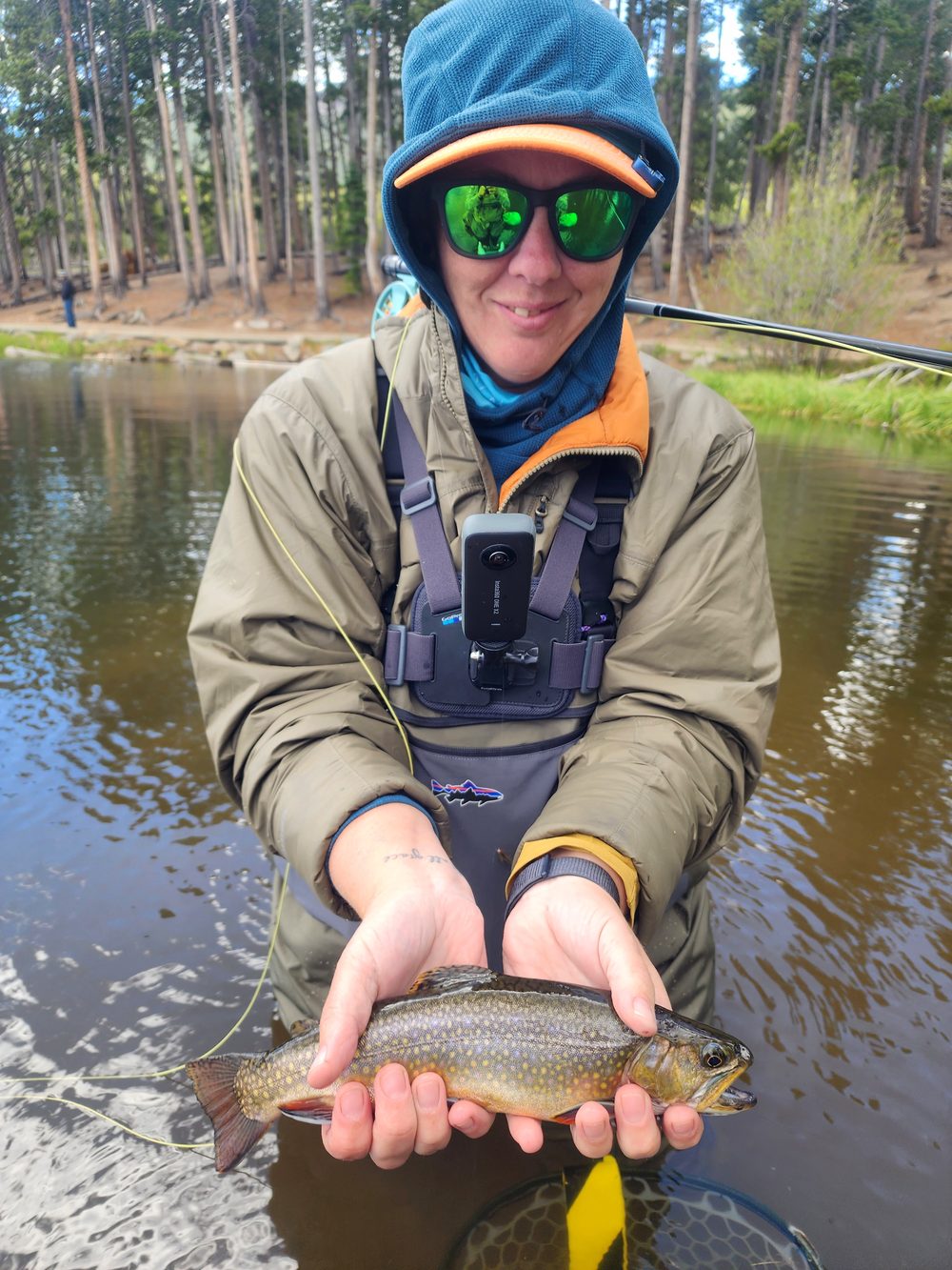 Niki Mosier holding a brook trout, the second fish of the weekend that inspired the Confidence Fly Search SEO toolkit